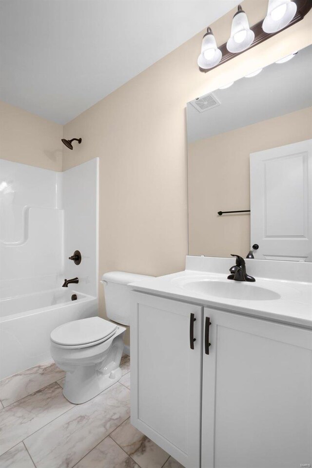 full bath with toilet, marble finish floor, visible vents, vanity, and bathing tub / shower combination