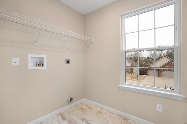 clothes washing area with electric dryer hookup, laundry area, washer hookup, baseboards, and marble finish floor
