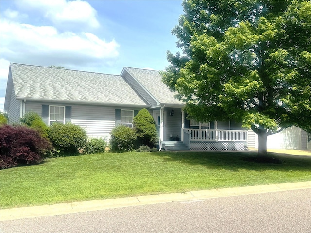ranch-style house with a front lawn, a porch, and a shingled roof