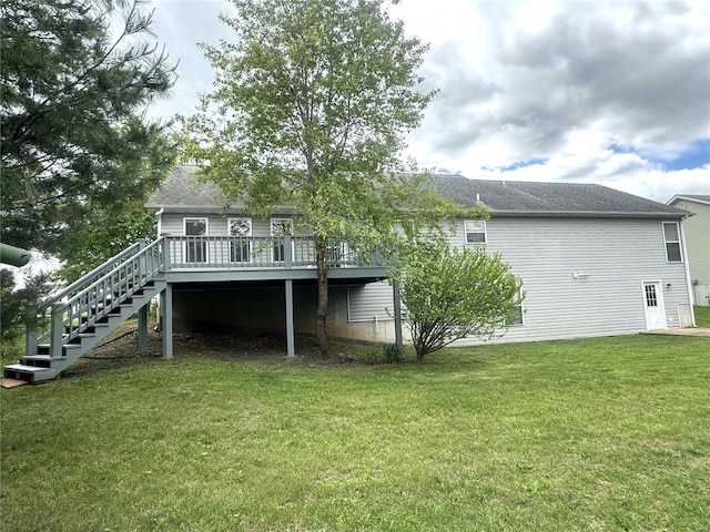 back of house with a lawn, stairs, and a deck