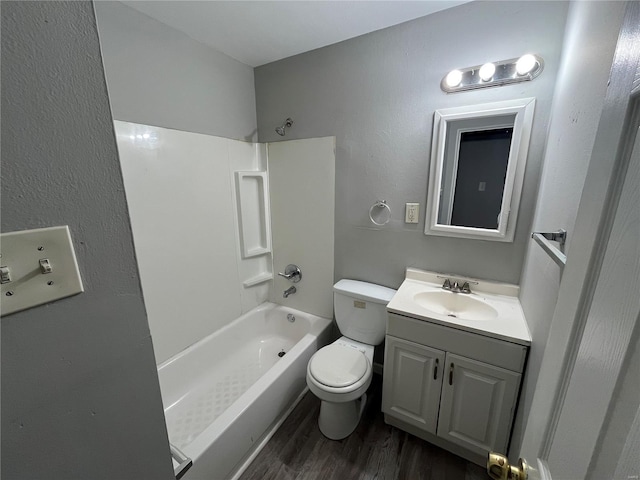 full bathroom with toilet, vanity, shower / tub combination, and wood finished floors