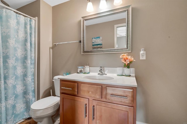 full bath featuring toilet, curtained shower, and vanity