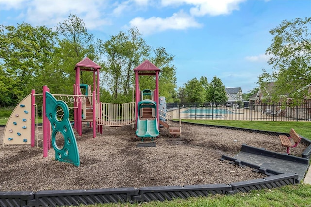 communal playground featuring fence