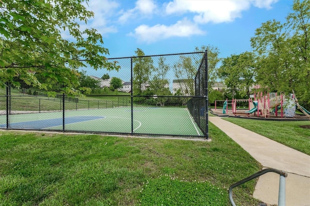 view of sport court featuring playground community, a yard, and fence