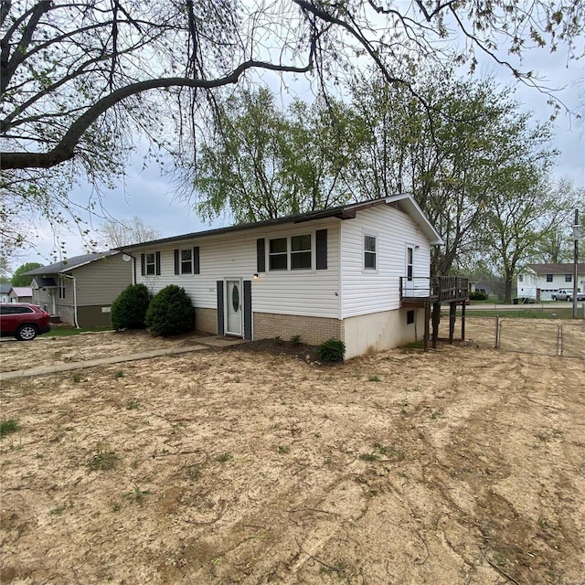view of front of property featuring a wooden deck