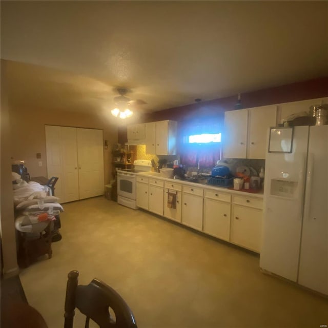 kitchen with white cabinets, light countertops, tasteful backsplash, and white appliances