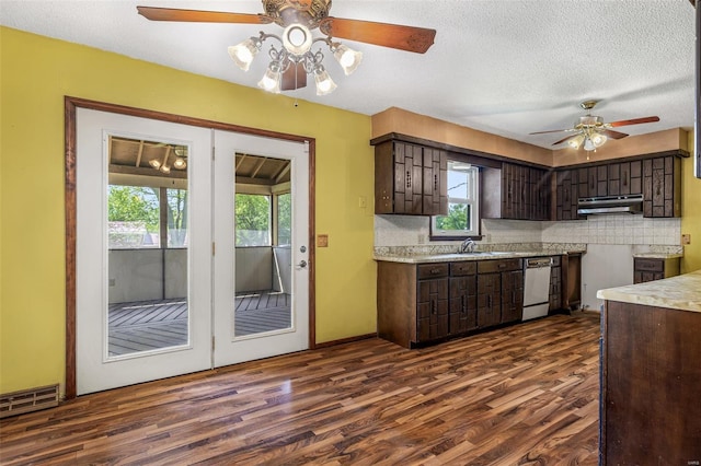 kitchen with ceiling fan, dishwasher, under cabinet range hood, dark brown cabinets, and dark wood finished floors