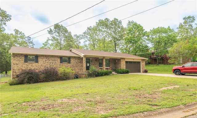 ranch-style home with an attached garage, concrete driveway, brick siding, and a front yard