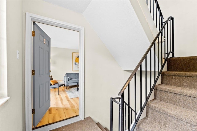 stairs with wood finished floors