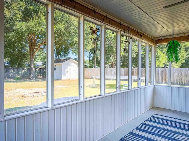 unfurnished sunroom featuring plenty of natural light