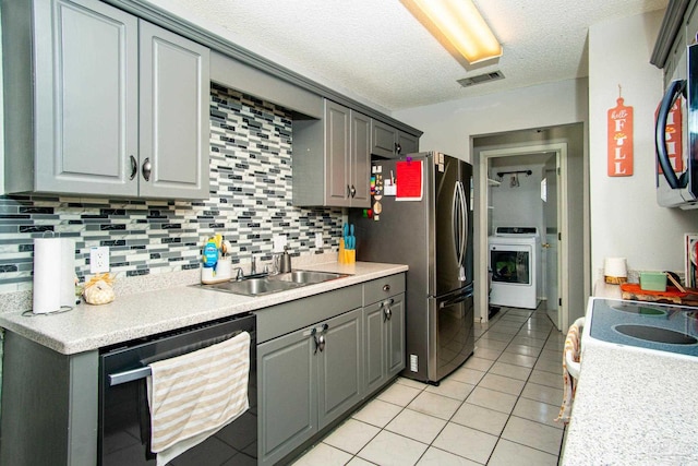 kitchen featuring black dishwasher, light countertops, visible vents, and gray cabinetry