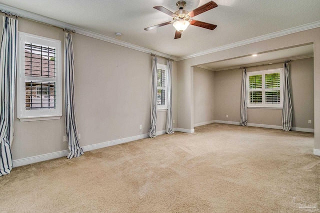 unfurnished room with ornamental molding, light carpet, a textured ceiling, and ceiling fan