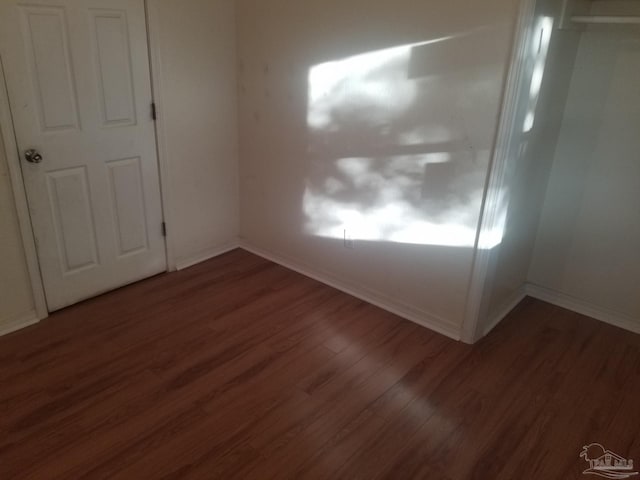 spare room featuring dark hardwood / wood-style floors