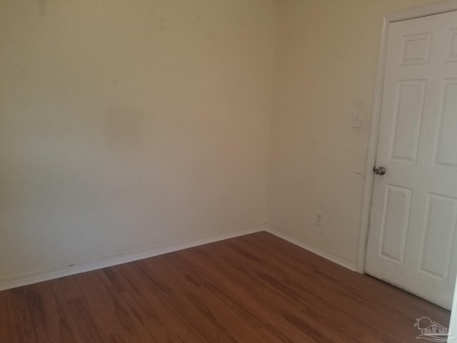 empty room with hardwood / wood-style floors