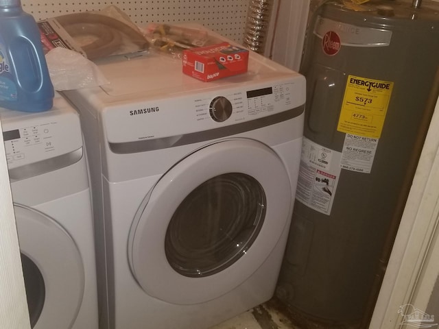 washroom with electric water heater and washing machine and dryer