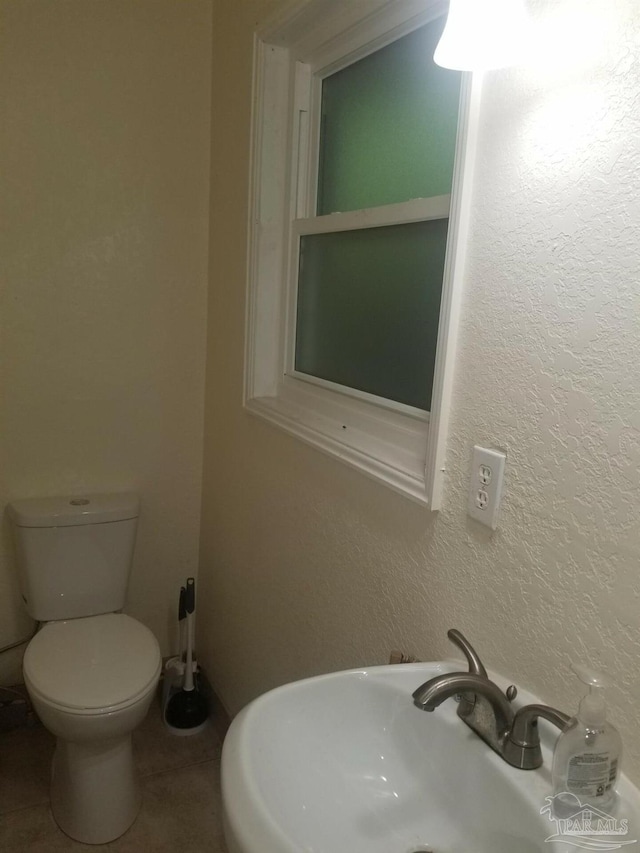 bathroom with toilet and sink