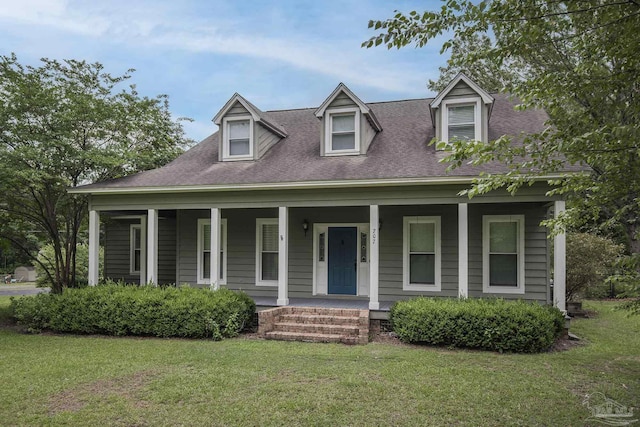 new england style home with a front yard and a porch