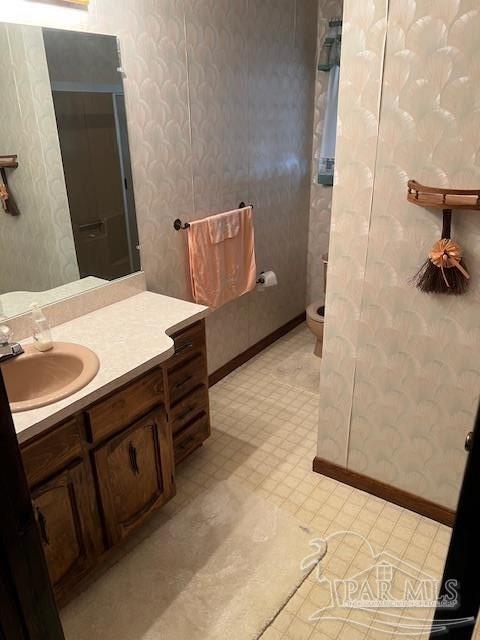 bathroom with vanity and toilet