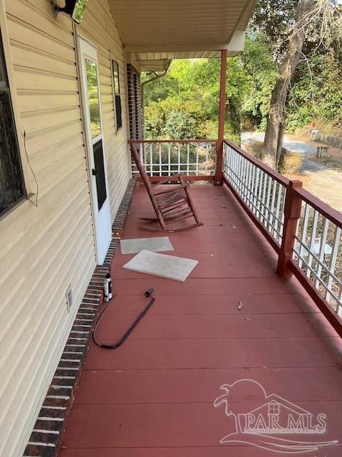 wooden terrace with a porch