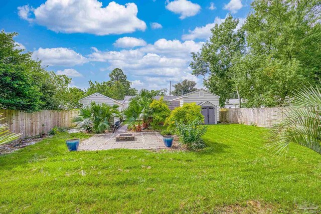 view of yard with a patio and a shed