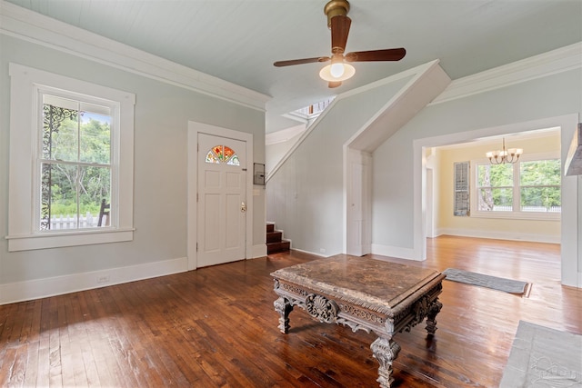 entrance foyer with hardwood / wood-style flooring, crown molding, and ceiling fan with notable chandelier