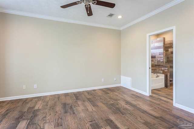 spare room with crown molding, dark hardwood / wood-style floors, and ceiling fan