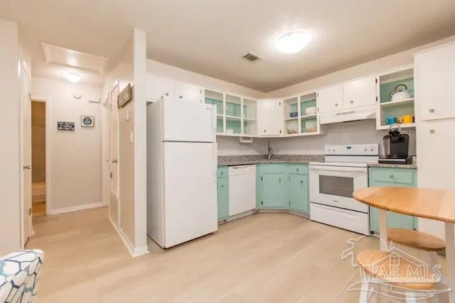 kitchen with light wood-type flooring, white appliances, premium range hood, and white cabinets