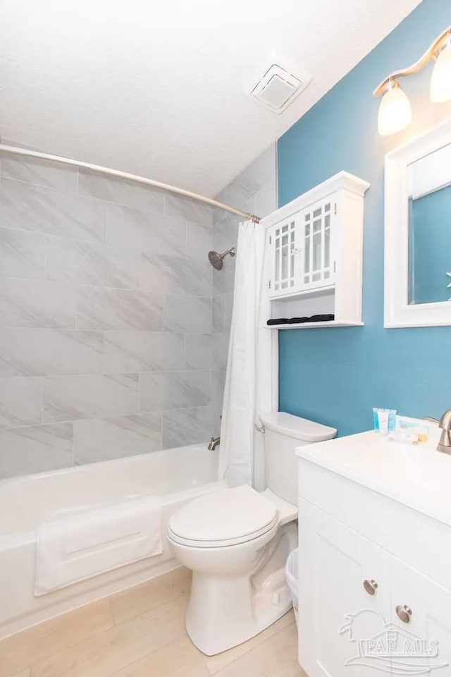 full bathroom with vanity, toilet, and shower / bathtub combination with curtain