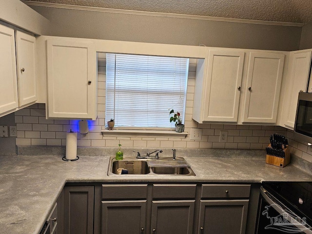 kitchen with white cabinets, backsplash, and sink