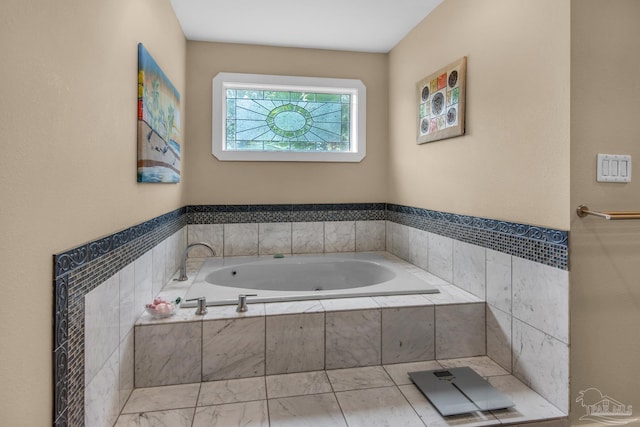 bathroom featuring a relaxing tiled tub