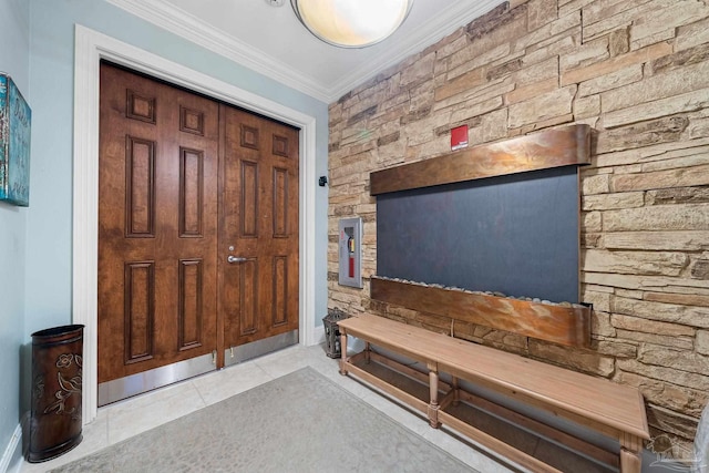 tiled foyer entrance with ornamental molding