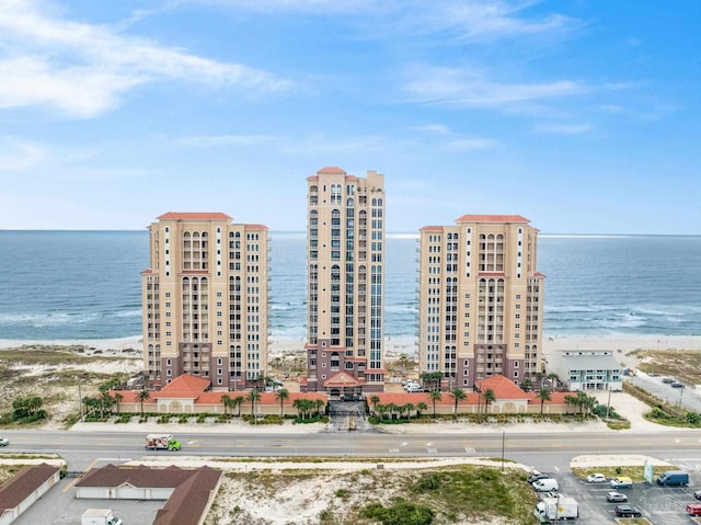 bird's eye view with a water view and a beach view