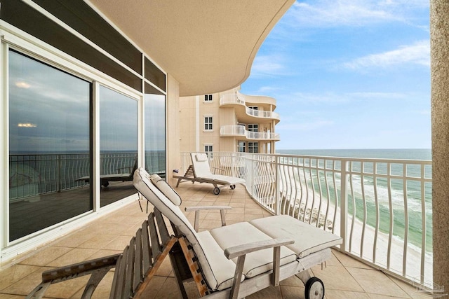 balcony with a view of the beach and a water view