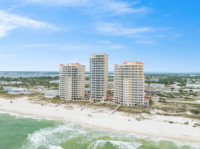 drone / aerial view with a water view and a view of the beach