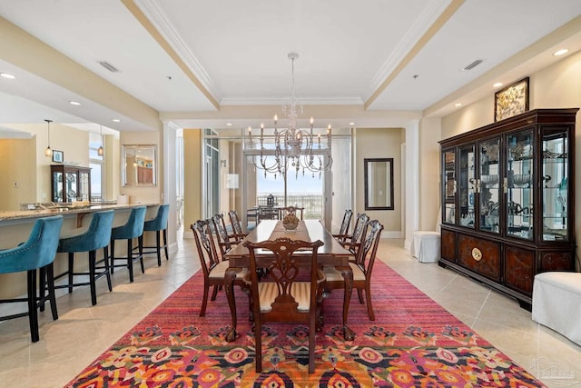 tiled dining area featuring ornamental molding and a notable chandelier