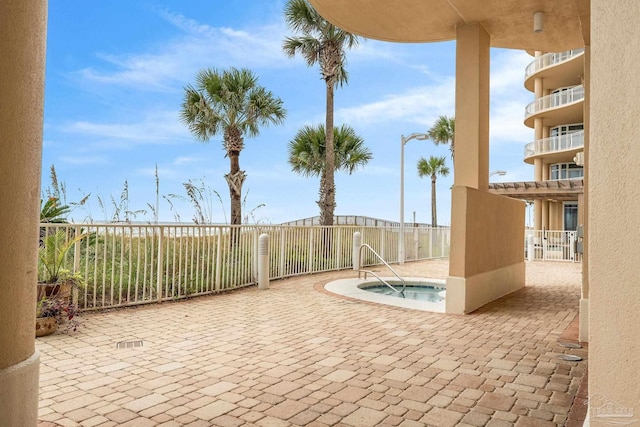 view of patio / terrace featuring a community hot tub