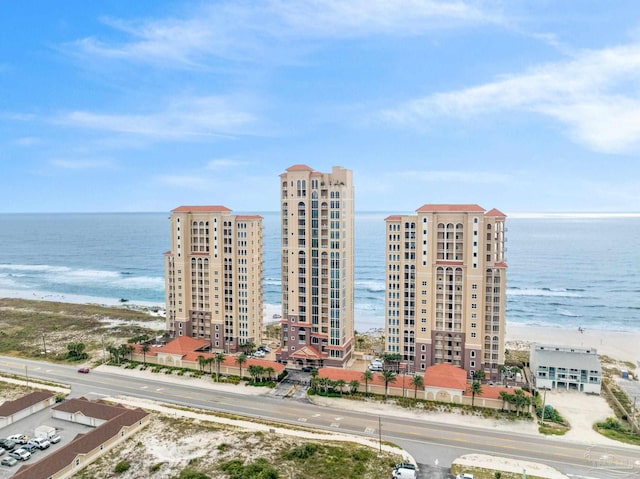 aerial view featuring a water view and a beach view