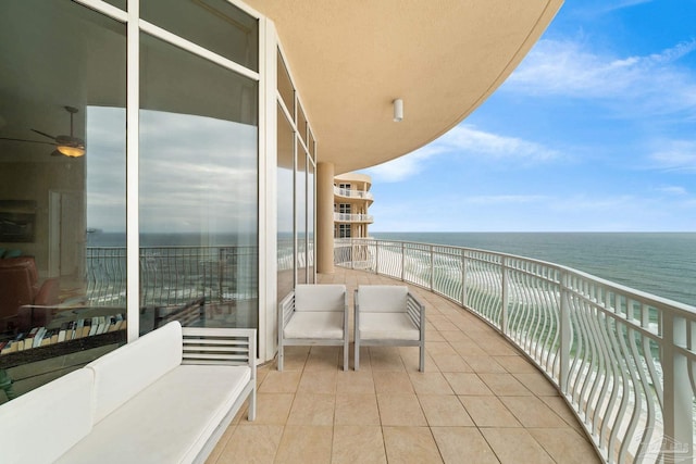 balcony featuring a water view and an outdoor hangout area