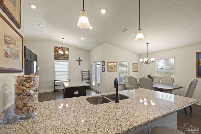 6319 Red Pepper Dr, Gulf Breeze, FL 32563 - kitchen featuring a chandelier, a sink, dark wood finished floors, a kitchen island, and lofted ceiling
