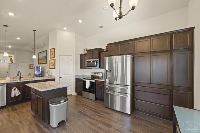 6319 Red Pepper Dr, Gulf Breeze, FL 32563 - kitchen with stainless steel appliances, a sink, dark brown cabinetry, dark wood-style floors, and recessed lighting
