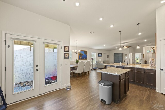 6319 Red Pepper Dr, Gulf Breeze, FL 32563 - kitchen with french doors, dark wood finished floors, open floor plan, dark brown cabinets, and recessed lighting