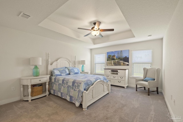 6319 Red Pepper Dr, Gulf Breeze, FL 32563 - bedroom featuring carpet floors, a raised ceiling, baseboards, and a ceiling fan