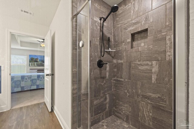 6319 Red Pepper Dr, Gulf Breeze, FL 32563 - ensuite bathroom featuring a shower stall and wood finished floors