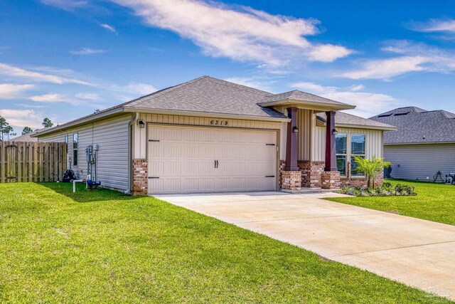 6319 Red Pepper Dr, Gulf Breeze, FL 32563 - ranch-style home featuring a garage, driveway, brick siding, and a shingled roof