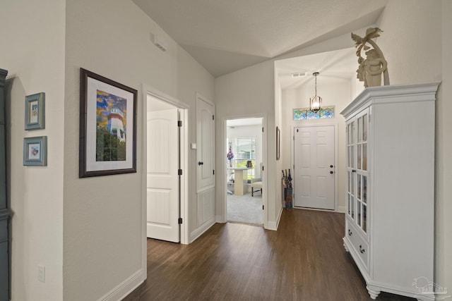 6319 Red Pepper Dr, Gulf Breeze, FL 32563 - foyer with dark wood-style floors, vaulted ceiling, and baseboards