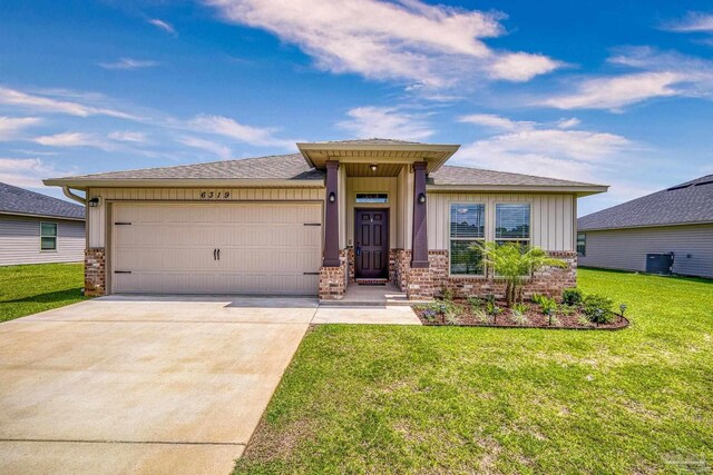 6319 Red Pepper Dr, Gulf Breeze, FL 32563 - view of front facade with an attached garage, board and batten siding, driveway, a front lawn, and brick siding
