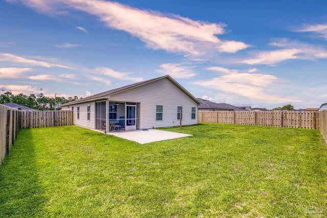 6319 Red Pepper Dr, Gulf Breeze, FL 32563 - back of house at dusk with a patio