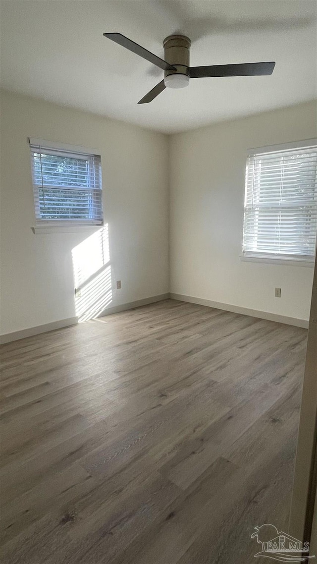 unfurnished room featuring ceiling fan and wood-type flooring