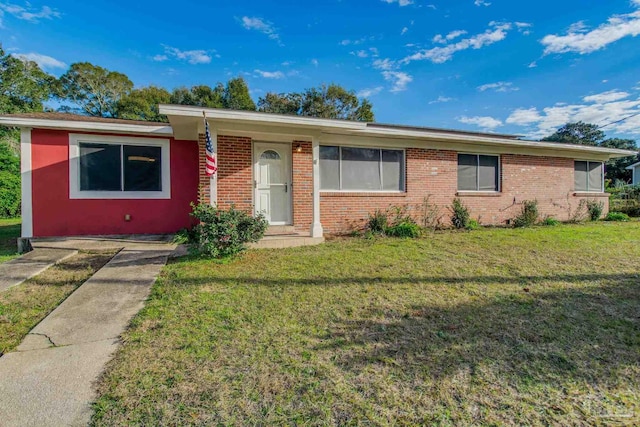 ranch-style home with a front lawn