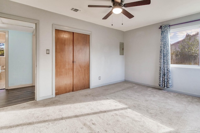 unfurnished bedroom featuring ceiling fan and light carpet